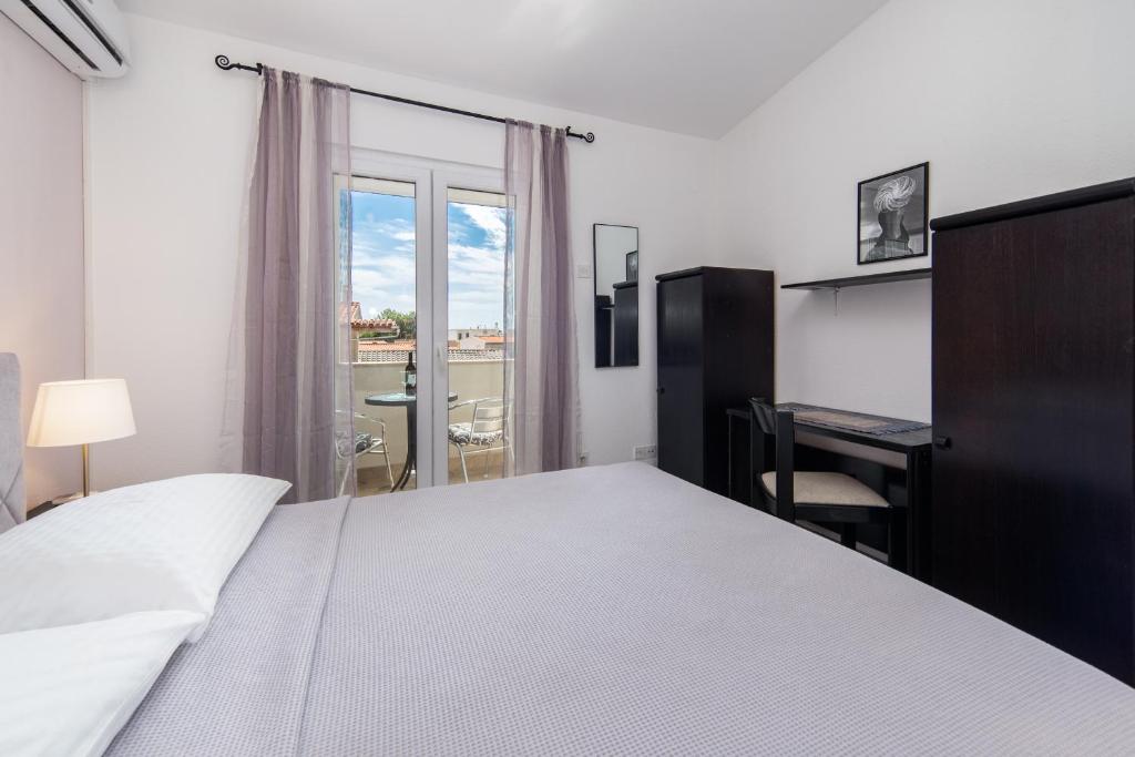 Posteľ alebo postele v izbe v ubytovaní Apartments Divna