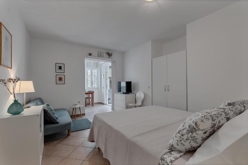 Posteľ alebo postele v izbe v ubytovaní Apartments Divna