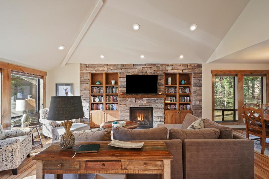 a living room with a couch and a fireplace at 3 Tumalo with Wood Burning Fireplace in Sunriver