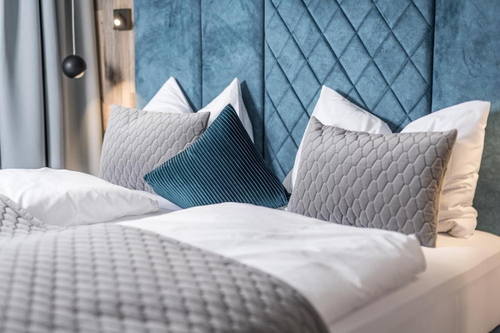 a bedroom with two beds with pillows at Perfect Lodgings Panorama in Hart im Zillertal