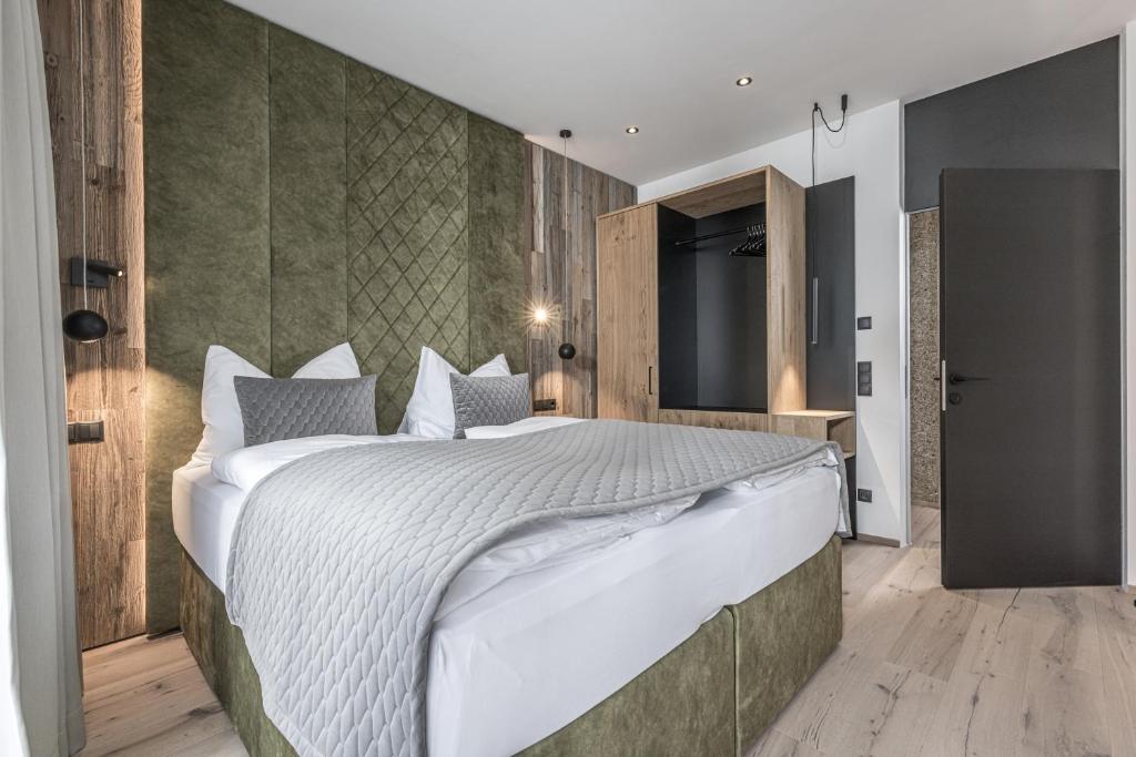 a bedroom with a large bed in a room at Perfect Lodgings Panorama in Hart im Zillertal
