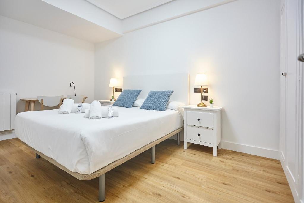 Posteľ alebo postele v izbe v ubytovaní Izpizua Apartment