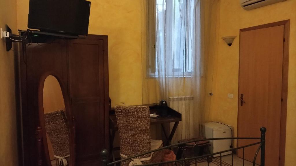 TV a/nebo společenská místnost v ubytování Palazzo Aprile