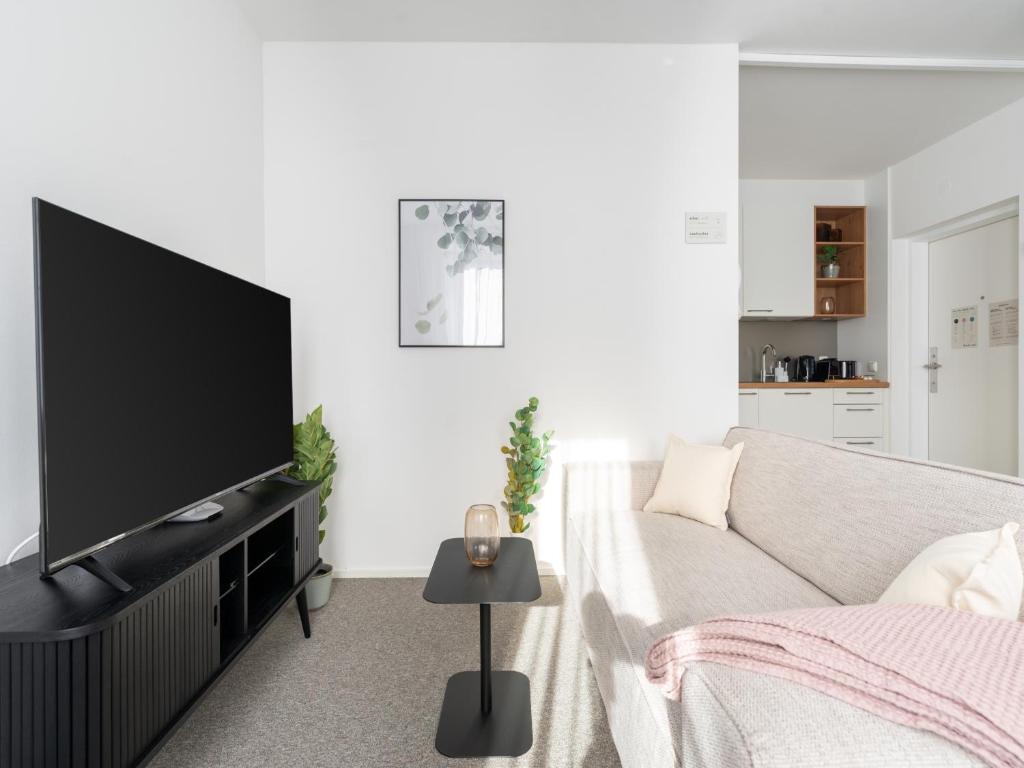 TV a/nebo společenská místnost v ubytování limehome Linz Friedrichstraße