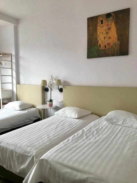 Postel nebo postele na pokoji v ubytování New City Hotel Scheveningen