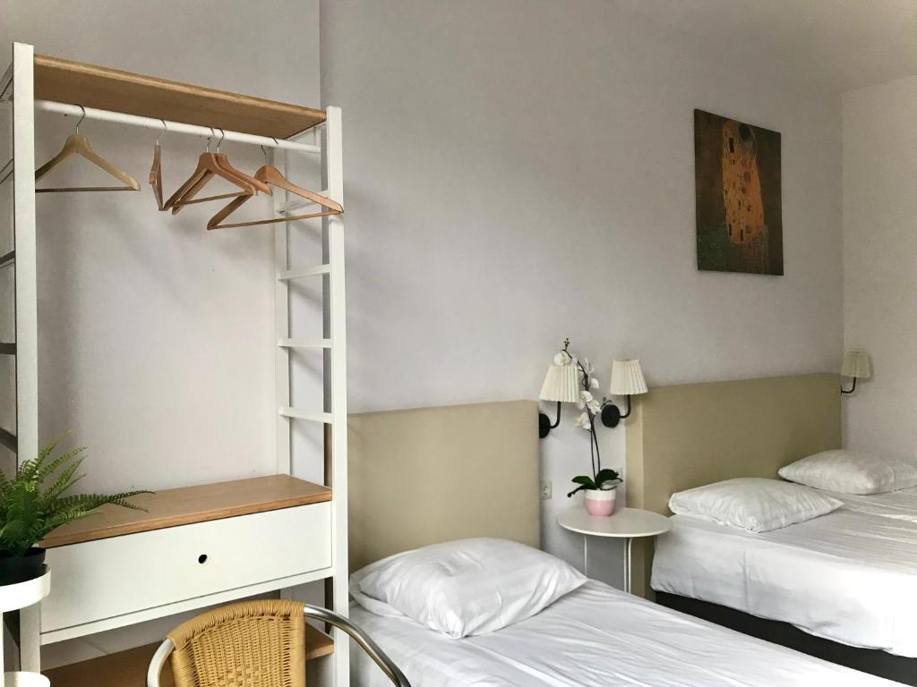 Postel nebo postele na pokoji v ubytování New City Hotel Scheveningen