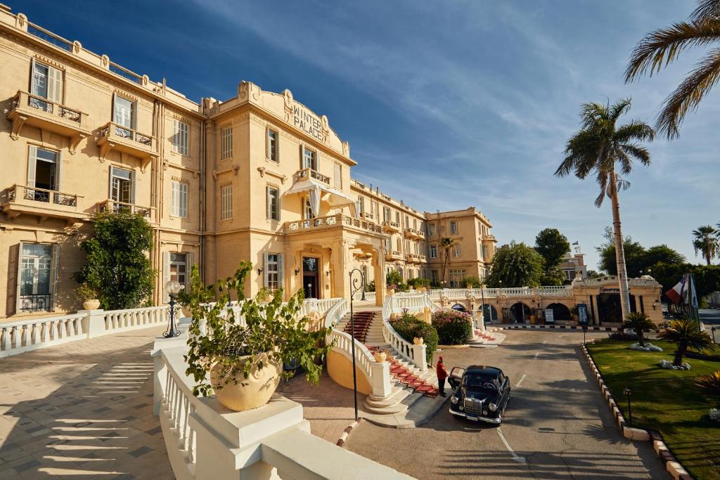 a building with a car parked in front of it at Sofitel Winter Palace Luxor in Luxor