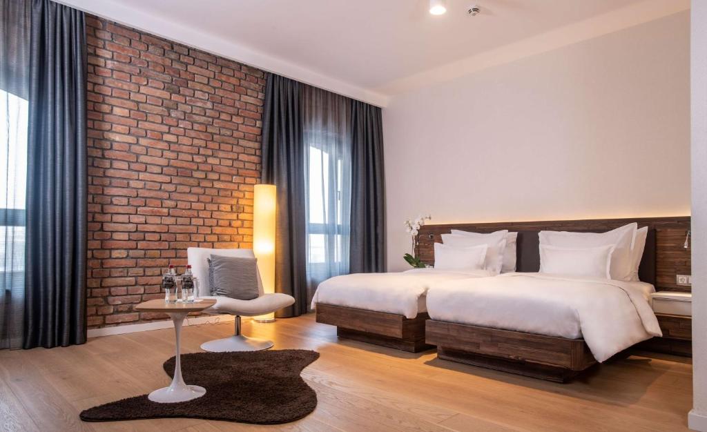 Postel nebo postele na pokoji v ubytování Radisson Collection Hotel, Old Mill Belgrade