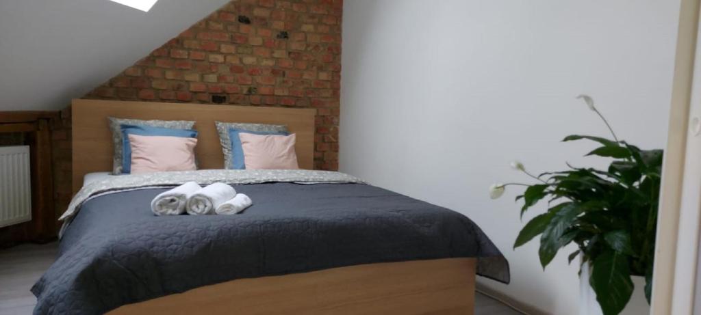 Posteľ alebo postele v izbe v ubytovaní Secret Apartament 2 Poznań