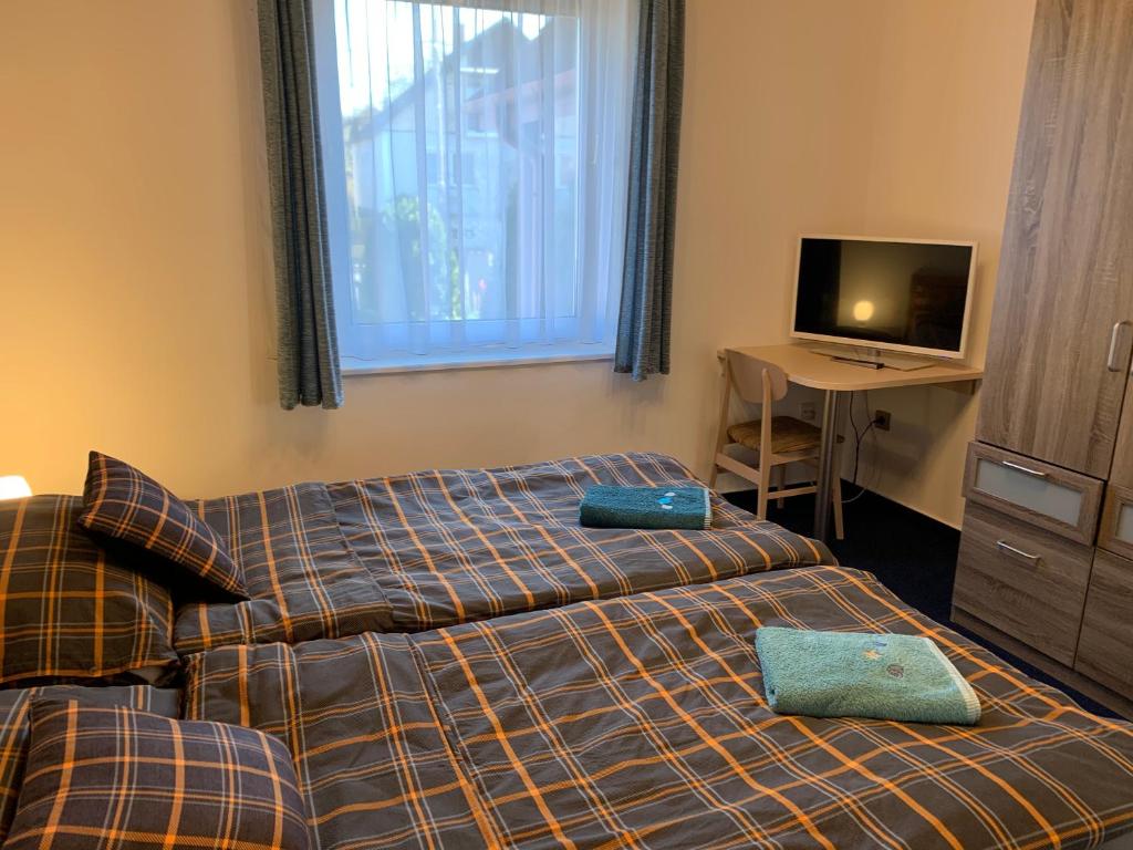 Łóżko lub łóżka w pokoju w obiekcie Apartman TinaSol