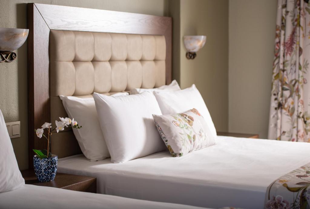 Postel nebo postele na pokoji v ubytování Hotel Olga