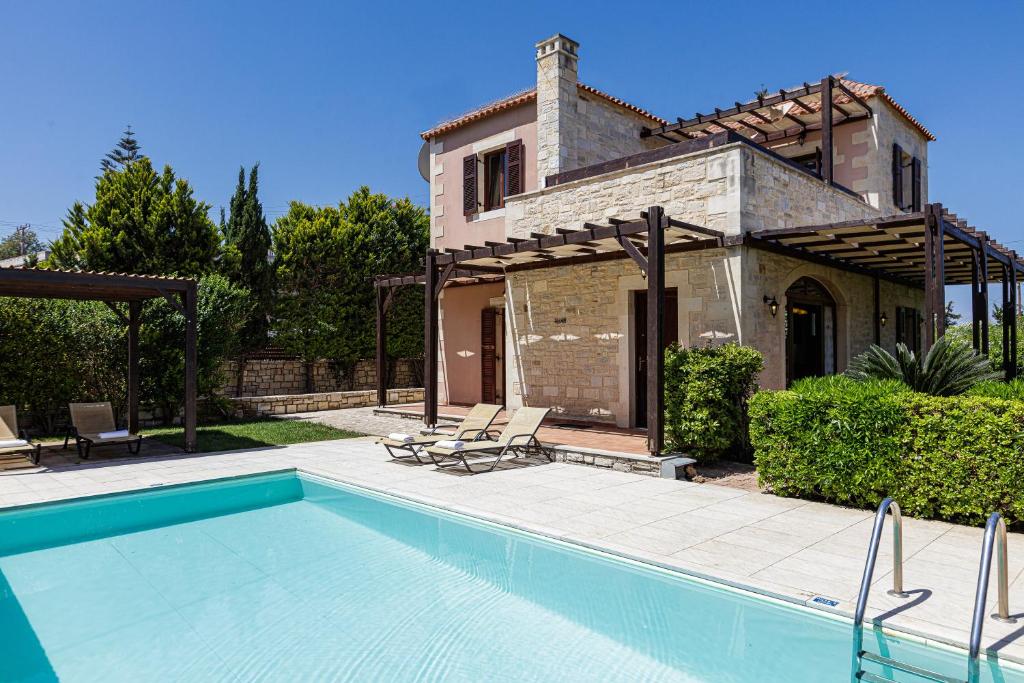 The swimming pool at or close to Kalimera villas