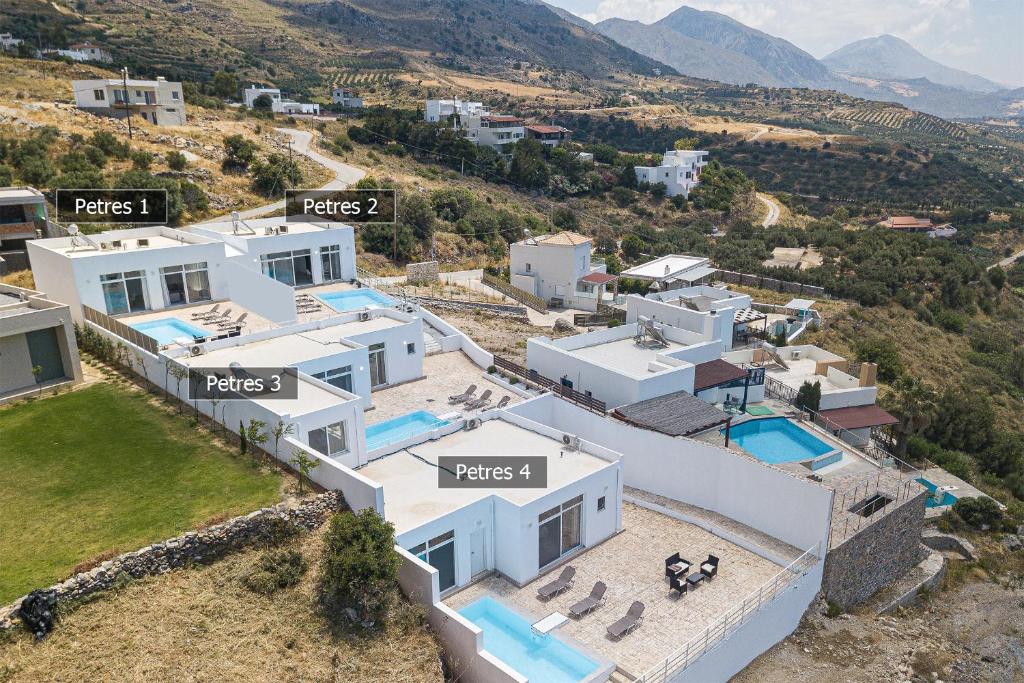 an aerial view of a villa in a valley at Petres Villas in Plakias
