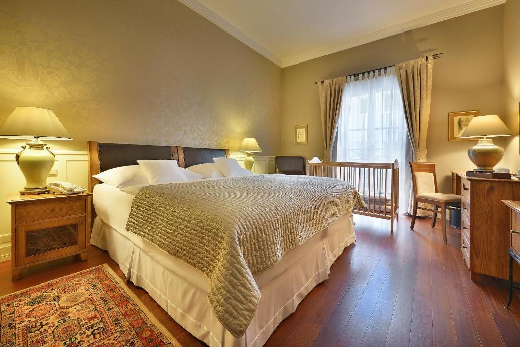 Postel nebo postele na pokoji v ubytování Marrol's Boutique Hotel