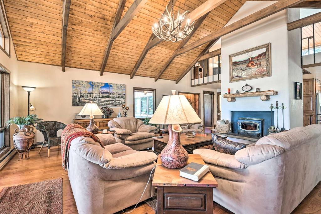 a living room with couches and a fireplace at Monte Verde Lake Lodge with Hot Tub 4 Mi to Ski in Angel Fire