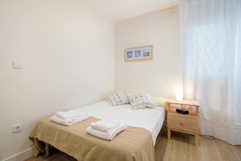 Postel nebo postele na pokoji v ubytování Bernia Apartment
