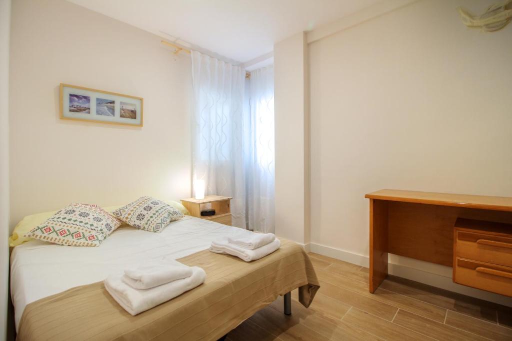 Postel nebo postele na pokoji v ubytování Bernia Apartment