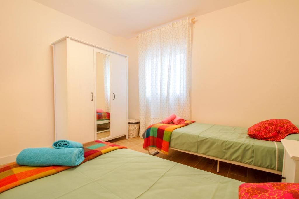 Postel nebo postele na pokoji v ubytování Bernia Apartment