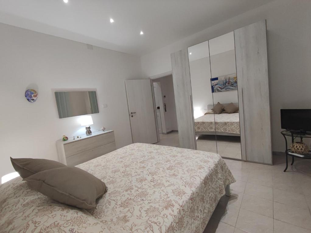 A bed or beds in a room at House Passarotti, 21