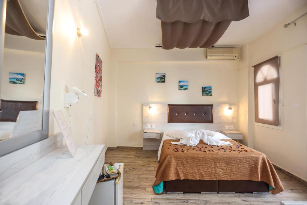 a bedroom with a bed in a room at Summer Beach Hotel in Polychrono