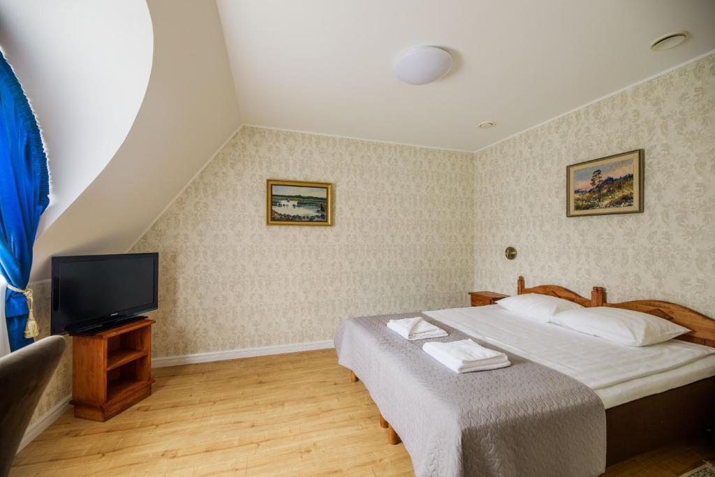 Postel nebo postele na pokoji v ubytování Saka Manor