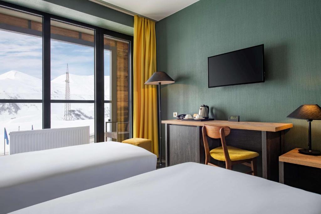 Postel nebo postele na pokoji v ubytování Best Western Gudauri