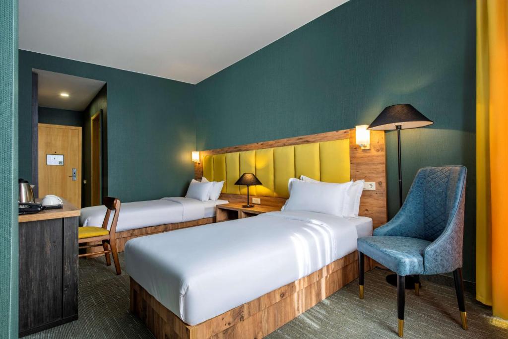 Postel nebo postele na pokoji v ubytování Best Western Gudauri