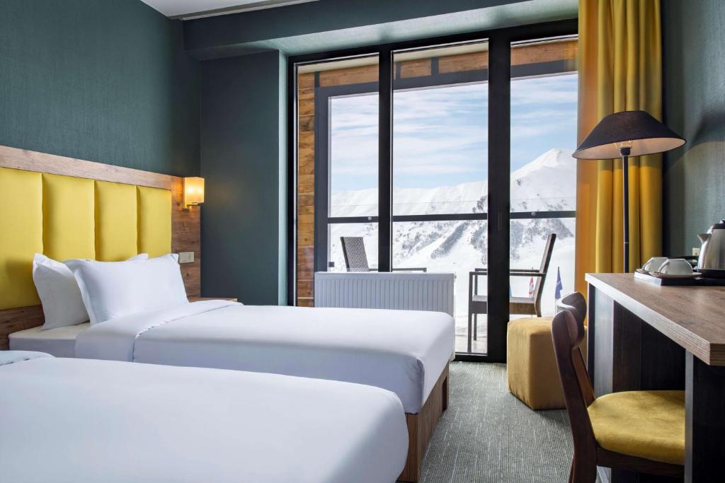 Postel nebo postele na pokoji v ubytování Best Western Gudauri
