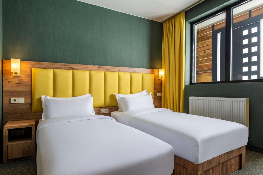 Postel nebo postele na pokoji v ubytování Best Western Gudauri