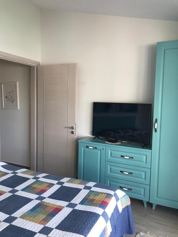 TV a/nebo společenská místnost v ubytování Bougainville Bay Resort - Villa 11