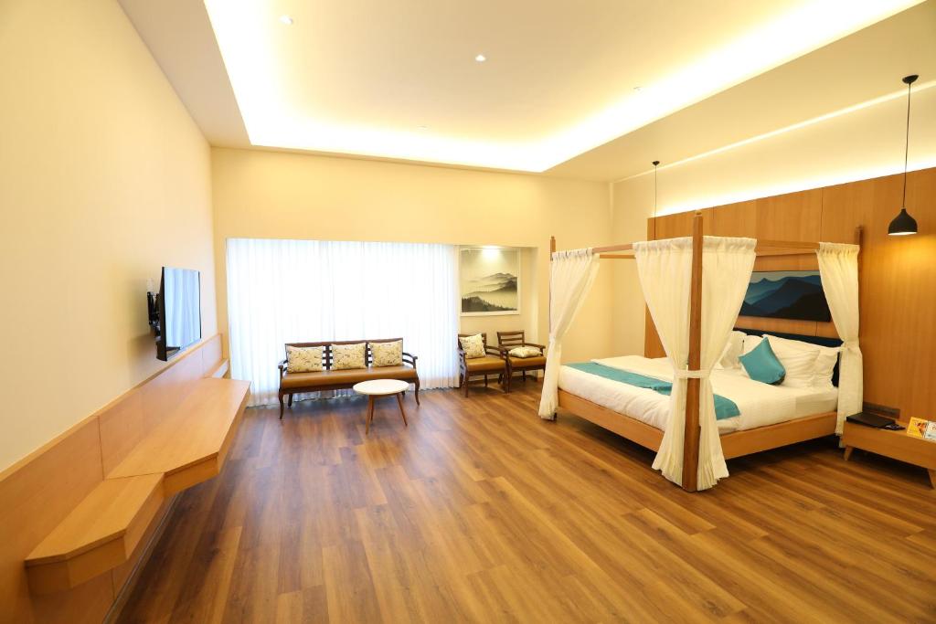 Postel nebo postele na pokoji v ubytování Hotel Blueivy Anand