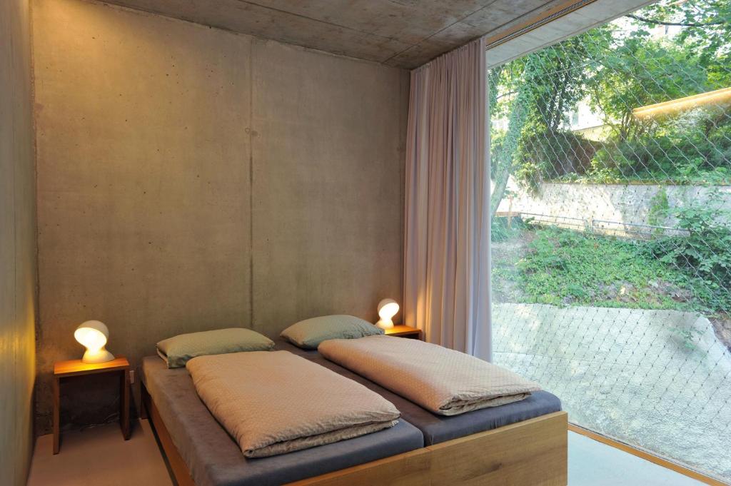 Postel nebo postele na pokoji v ubytování Basel Youth Hostel