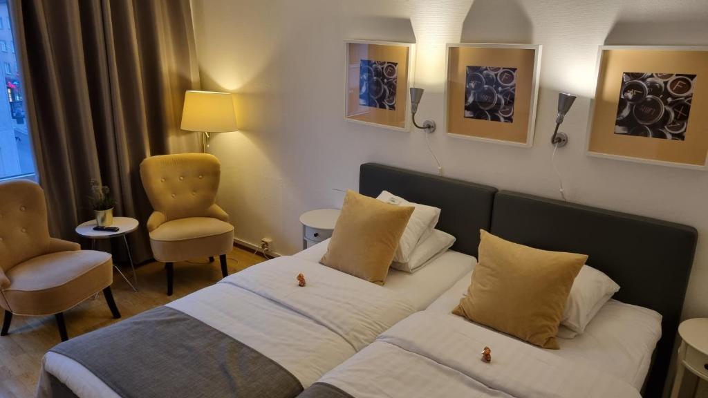 Postel nebo postele na pokoji v ubytování Hotell Västerås