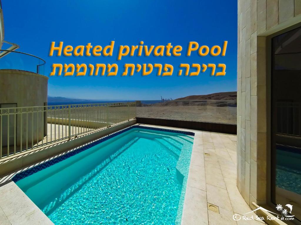 a swimming pool in the backyard of a house at exclusif apartment by the sea in Eilat