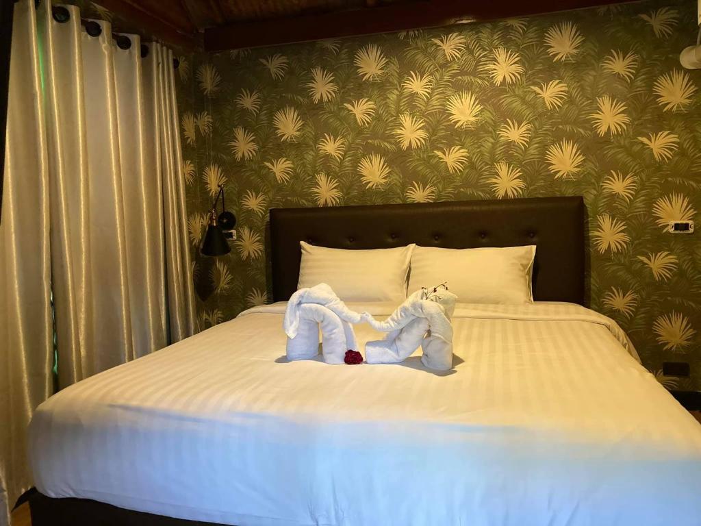 Postel nebo postele na pokoji v ubytování Nokkamin Home Chiang Dao