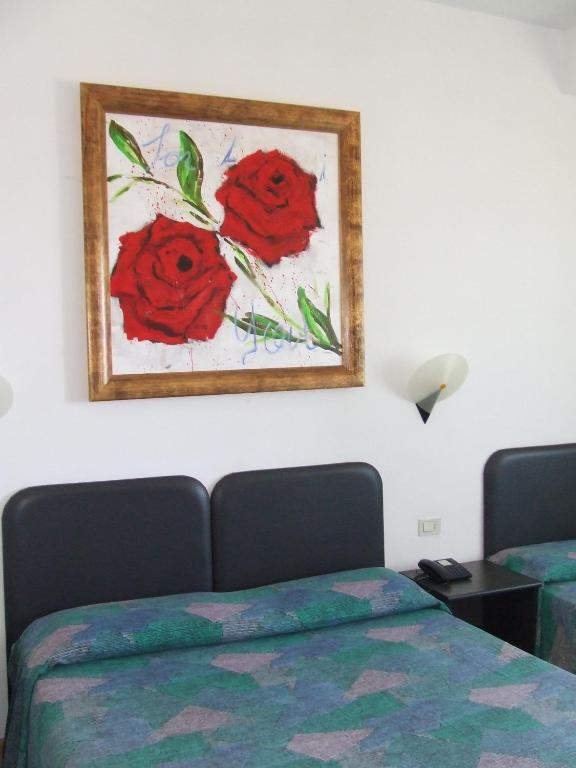 Postel nebo postele na pokoji v ubytování Hotel Borgo Marina