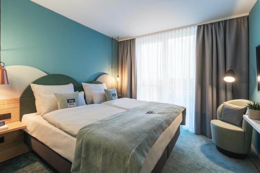 Postel nebo postele na pokoji v ubytování Holiday Inn - the niu, Cure Erlangen by IHG