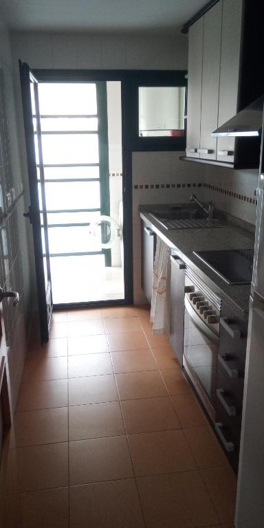 Kuchyň nebo kuchyňský kout v ubytování Apartamento Completo Torresol IV
