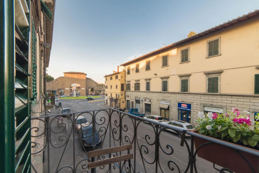 a balcony with a view of a street and buildings at Flower House - Dolcevita Holiday in Florence