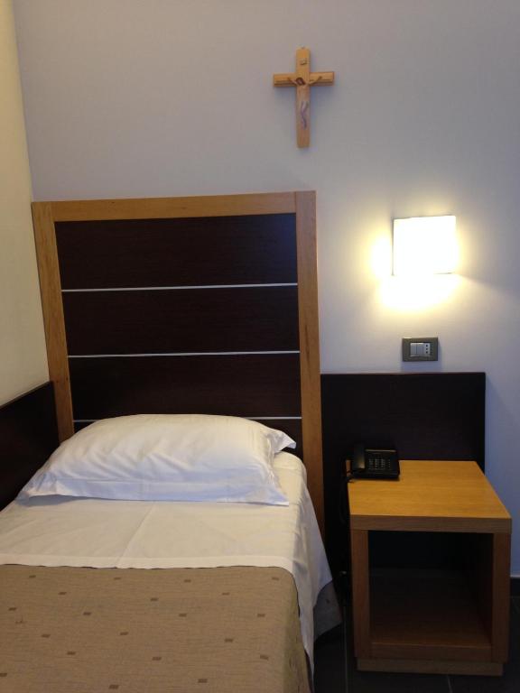 Postel nebo postele na pokoji v ubytování Hotel Vittoria