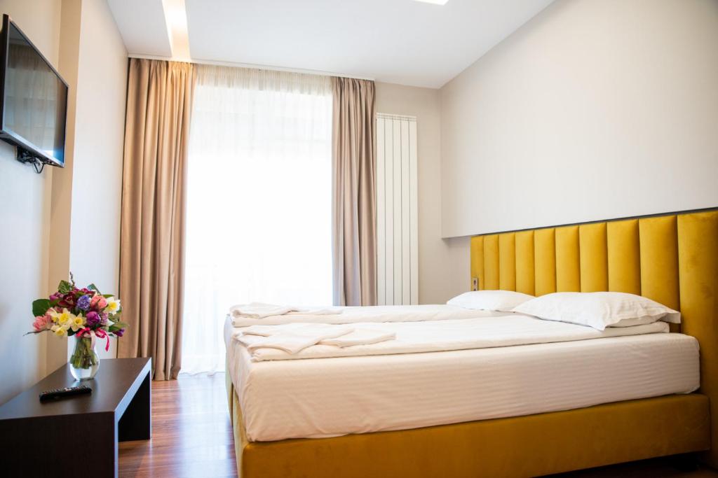 Postel nebo postele na pokoji v ubytování HOTEL VITAL