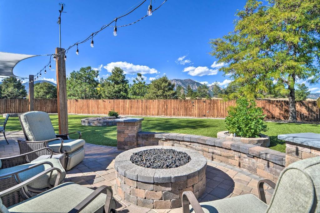 a patio with a fire pit in a yard at Family-Friendly Home with Back Yard and Game Room! in Boulder