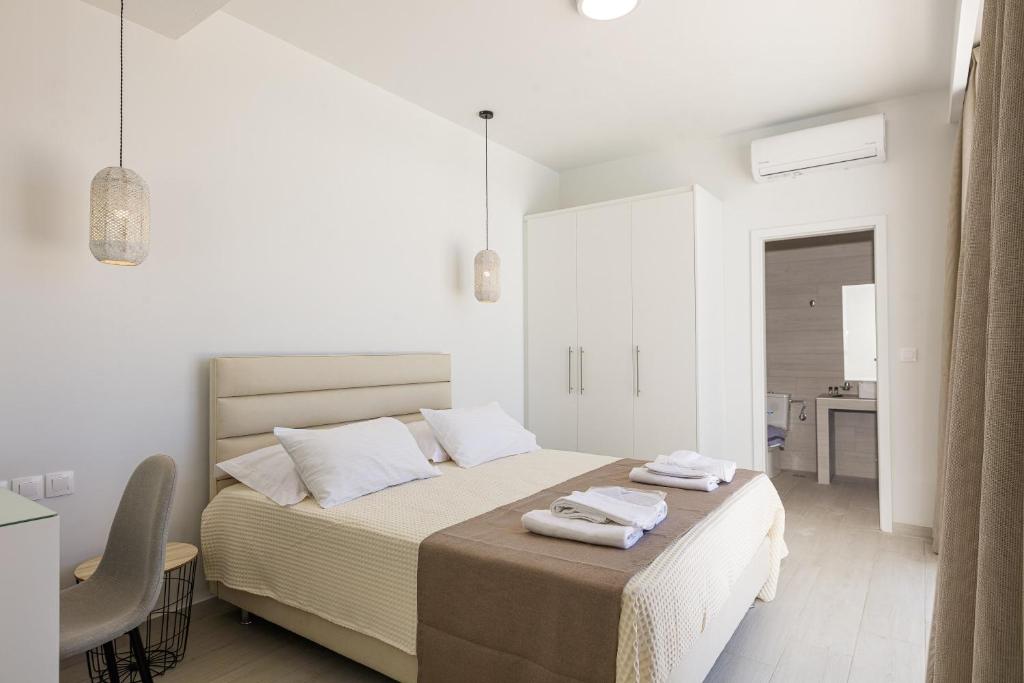 Posteľ alebo postele v izbe v ubytovaní Petres Villas