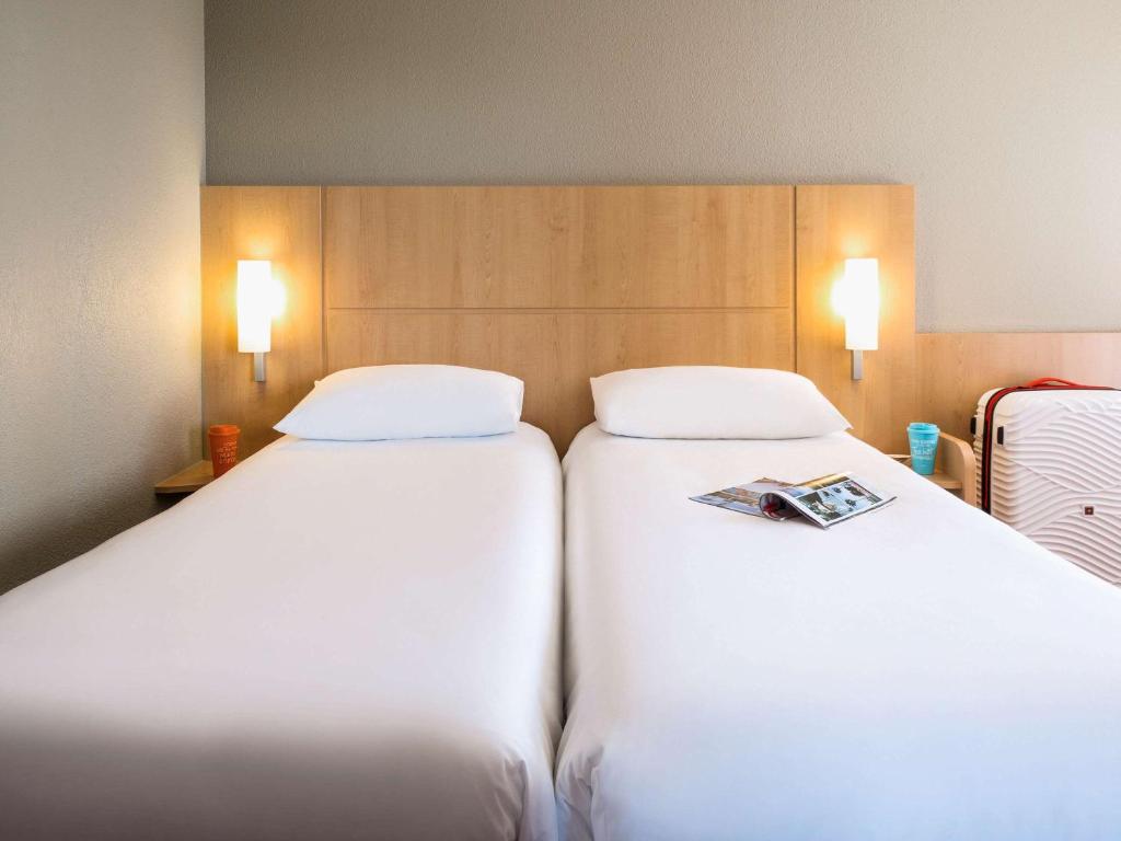 Postel nebo postele na pokoji v ubytování ibis Lausanne Crissier