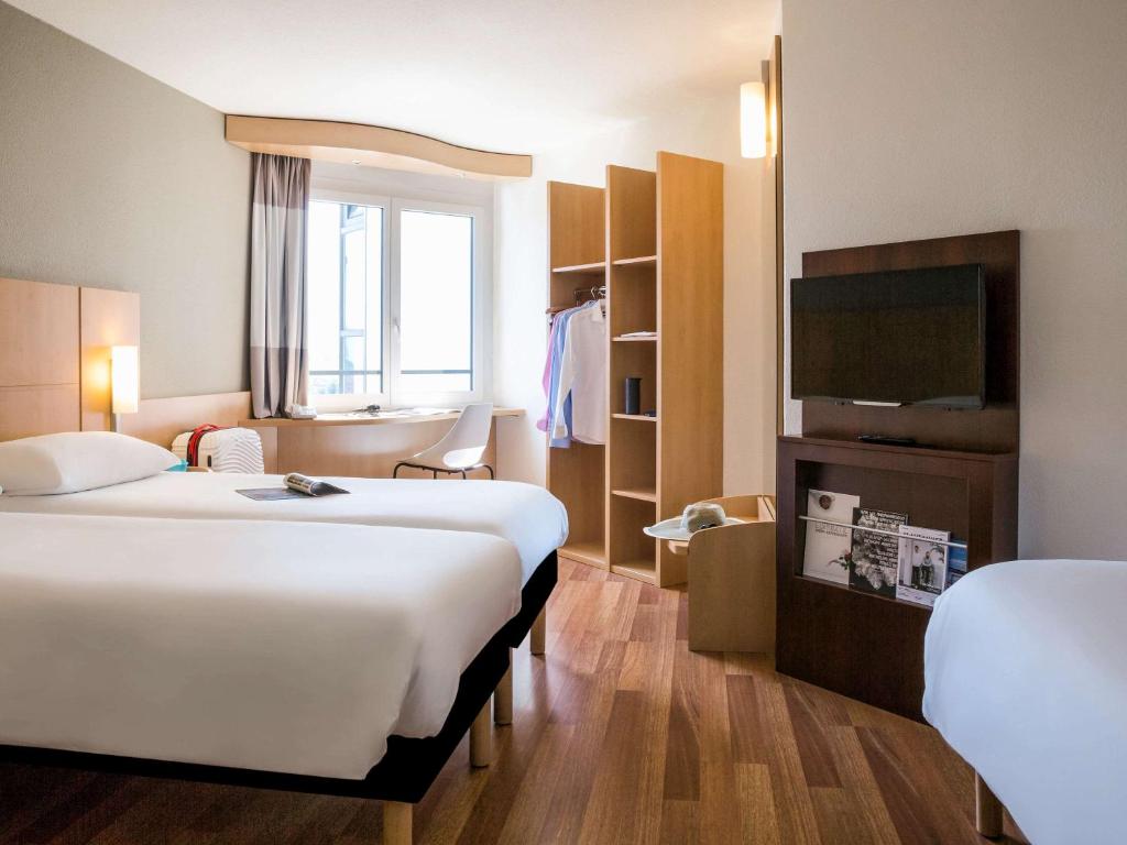 Postel nebo postele na pokoji v ubytování ibis Lausanne Crissier