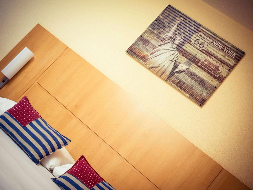 Postel nebo postele na pokoji v ubytování ibis Lausanne Crissier