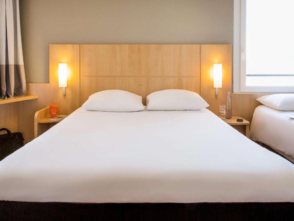 Postel nebo postele na pokoji v ubytování ibis Lausanne Crissier