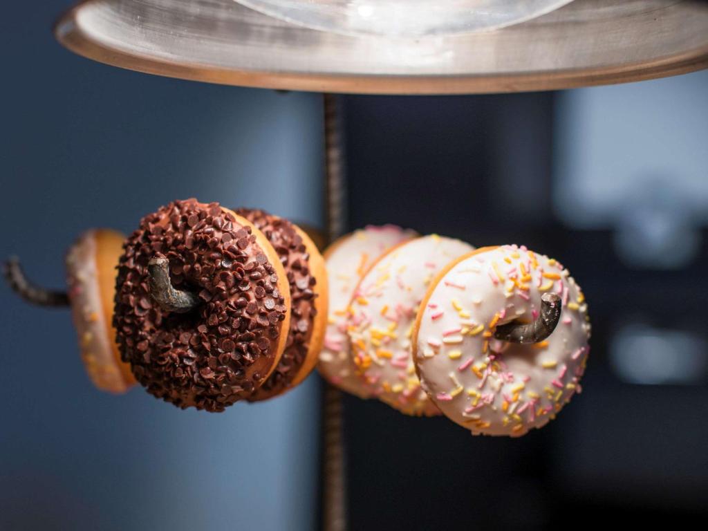 a group of donuts hanging on a rack at Almar Timi Ama Resort & Spa in Villasimius