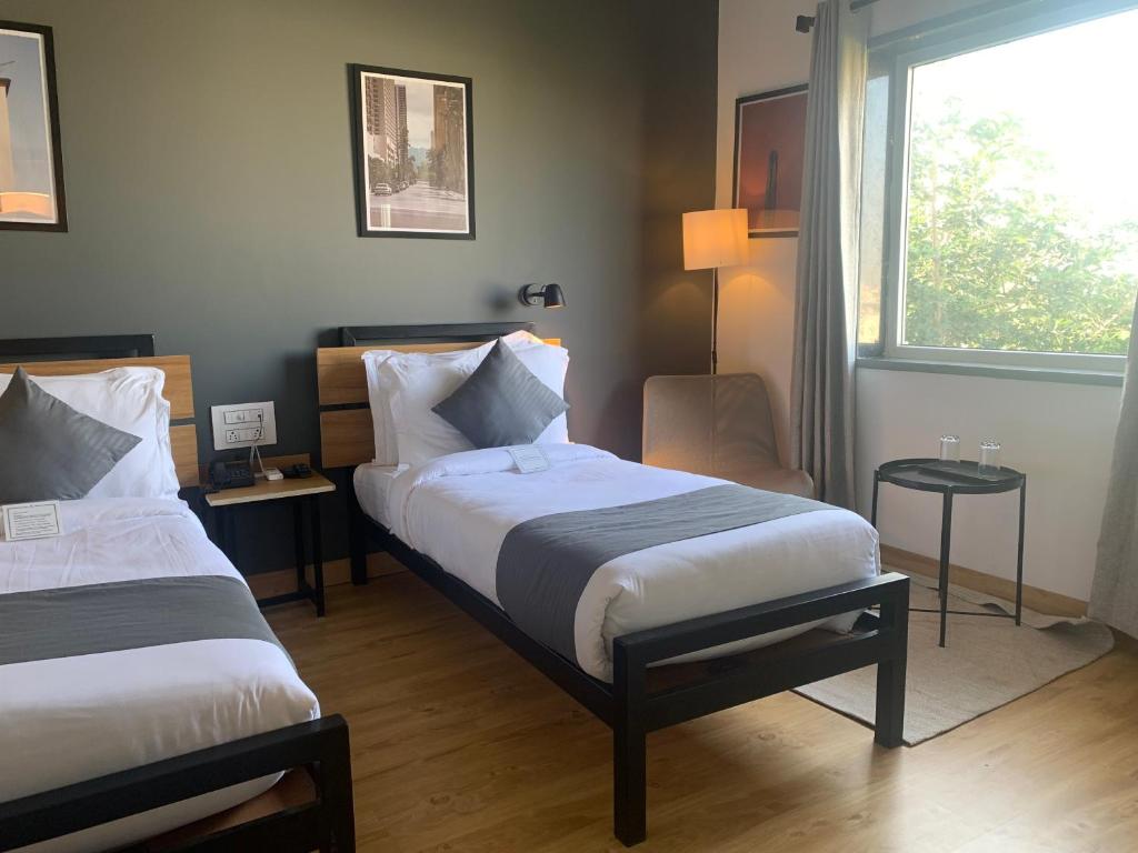 Postel nebo postele na pokoji v ubytování Loft 24, Mansarovar