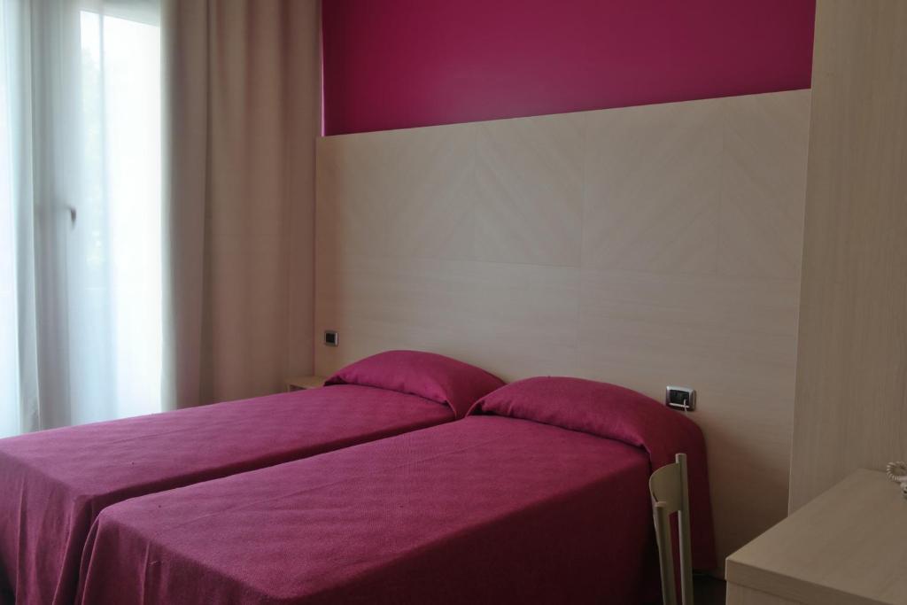 Letto o letti in una camera di Hotel Paradiso